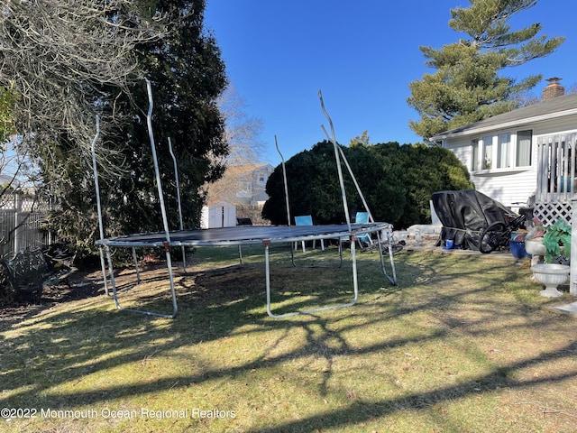 view of yard with a trampoline