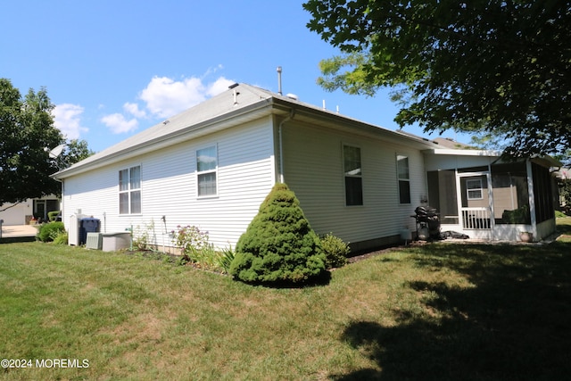 rear view of house with a yard