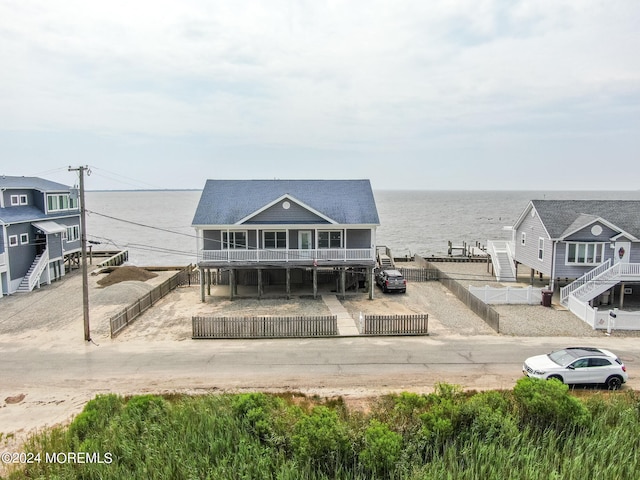 back of property with a water view