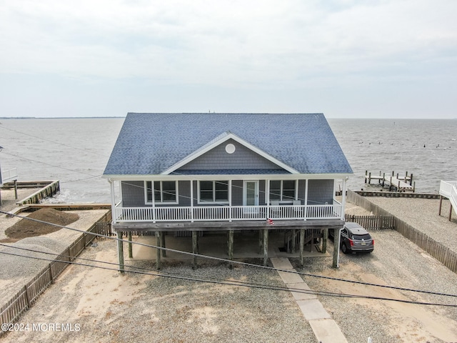 exterior space featuring a carport and a water view