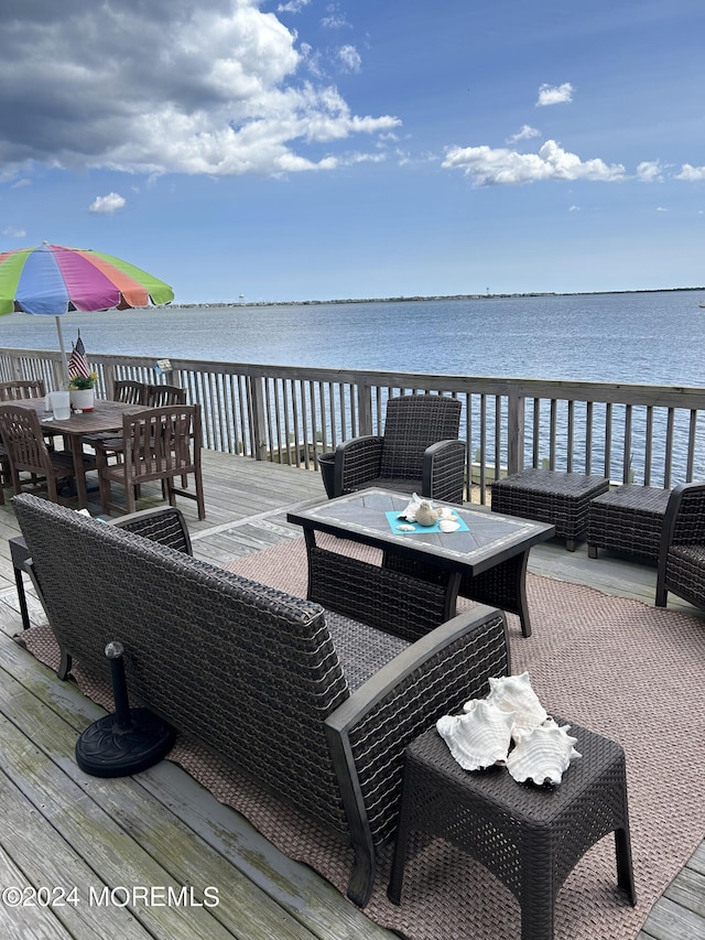 wooden deck with a water view