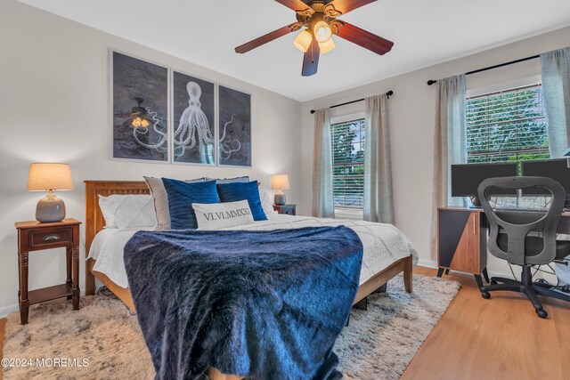 bedroom featuring ceiling fan and hardwood / wood-style floors