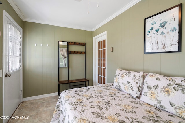 bedroom with crown molding and wooden walls