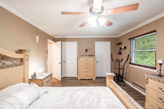 bedroom with hardwood / wood-style floors, ceiling fan, and ornamental molding