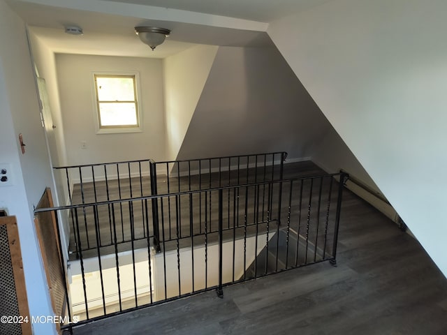 staircase with wood finished floors