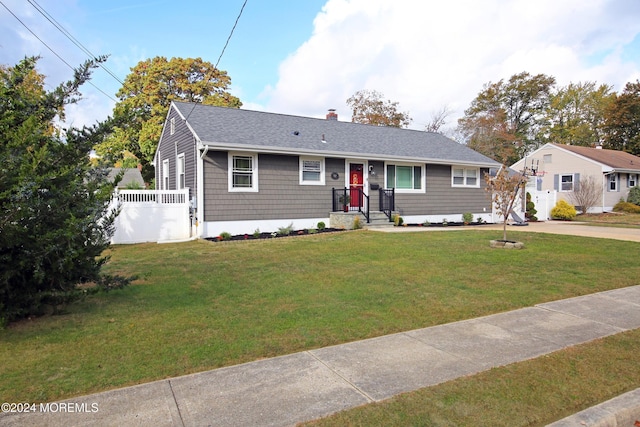 view of front of home with a front lawn