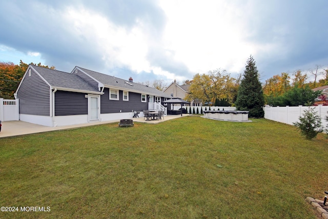 exterior space with a gazebo, a covered pool, and a patio