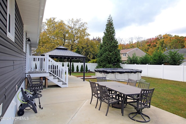 view of patio / terrace featuring a covered pool and a gazebo