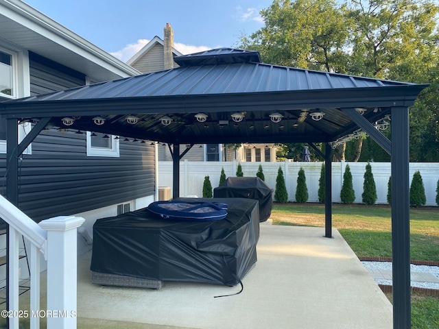 view of patio featuring area for grilling and a gazebo