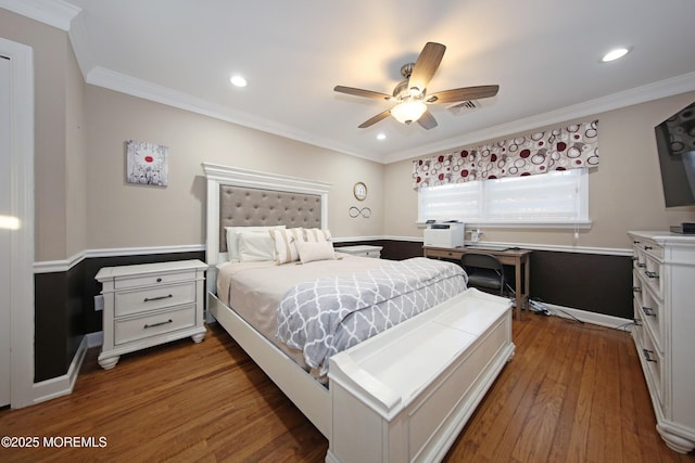 bedroom featuring ceiling fan, crown molding, and dark hardwood / wood-style floors