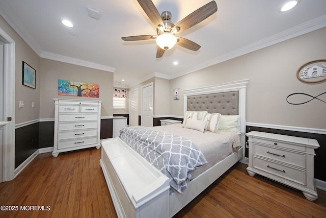 bedroom with ornamental molding, ceiling fan, a closet, and dark hardwood / wood-style floors