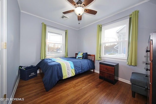 bedroom featuring ornamental molding, ceiling fan, dark hardwood / wood-style flooring, and multiple windows