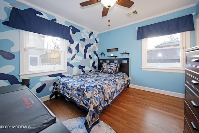 bedroom with ceiling fan, dark wood-type flooring, and ornamental molding