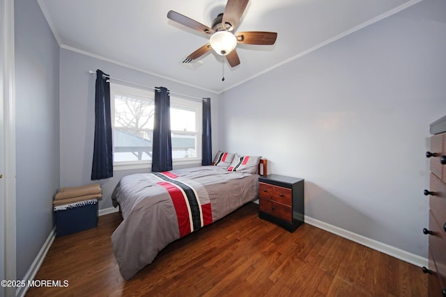 bedroom featuring ceiling fan, dark hardwood / wood-style flooring, and ornamental molding