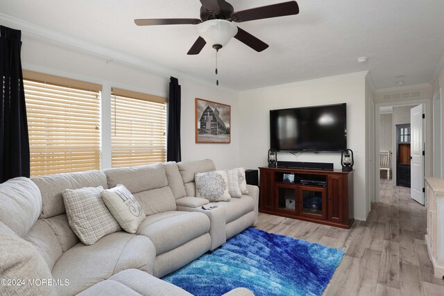 living room featuring crown molding, hardwood / wood-style floors, and ceiling fan