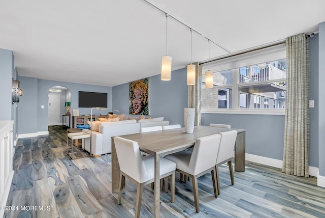 dining space featuring light wood-type flooring