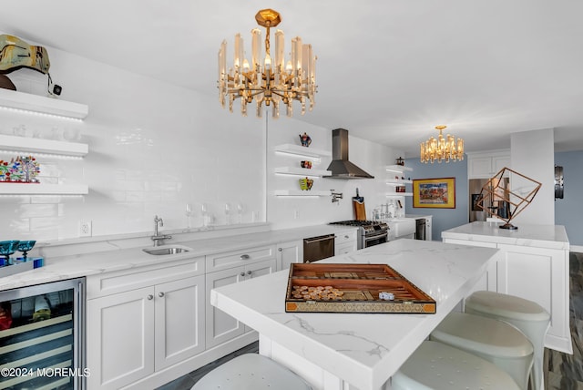 kitchen featuring wine cooler, a center island, an inviting chandelier, and island exhaust hood