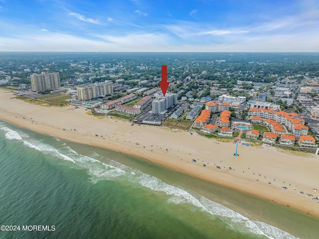 aerial view featuring a water view and a view of the beach