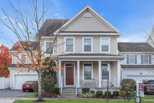 view of front of home featuring a garage and a porch