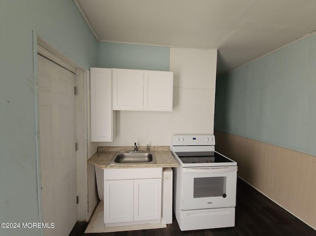 kitchen with sink, white cabinetry, white electric stove, and hardwood / wood-style flooring