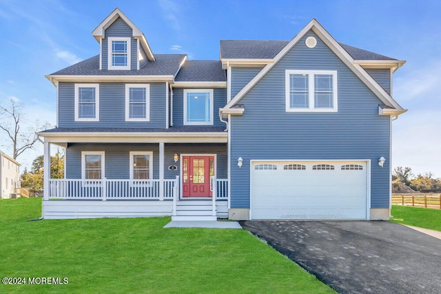 view of front of home with a front yard, a porch, and a garage