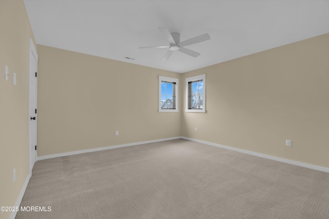 carpeted empty room with ceiling fan