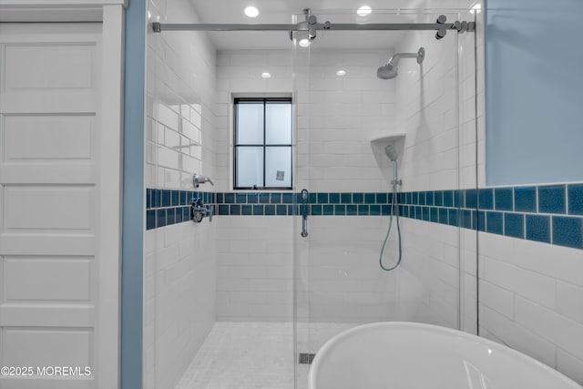 bathroom with a shower with shower door