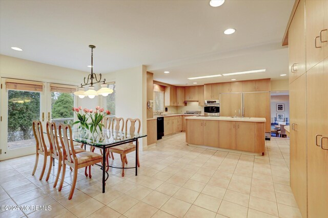 dining space featuring light tile patterned flooring and an inviting chandelier