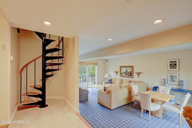 living room featuring stairs, baseboards, and recessed lighting