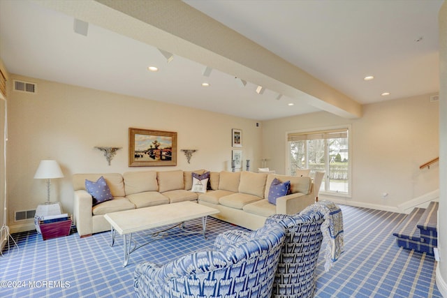 living room featuring carpet floors, beamed ceiling, visible vents, and baseboards