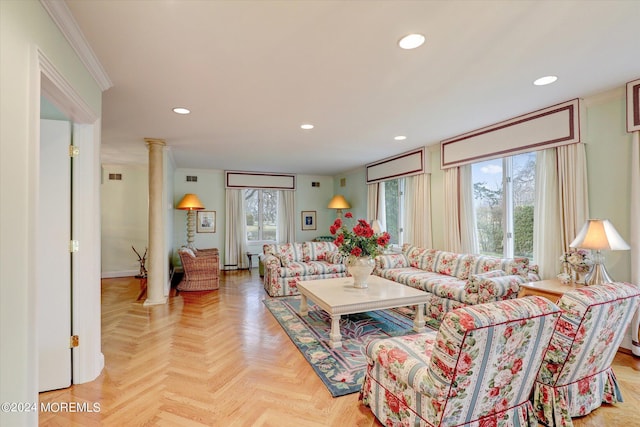 living area with ornamental molding, recessed lighting, and ornate columns