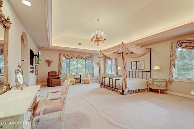 carpeted bedroom with a chandelier, arched walkways, a raised ceiling, and multiple windows