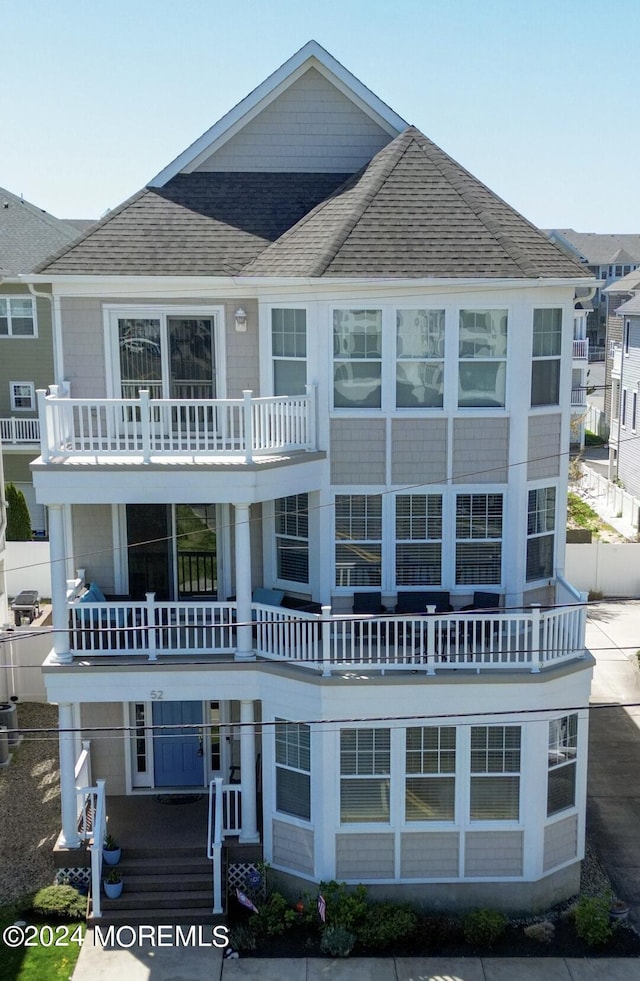 52 Seaview Ave, Long Branch, NJ 07740 - rear view of property featuring a shingled roof and a balcony