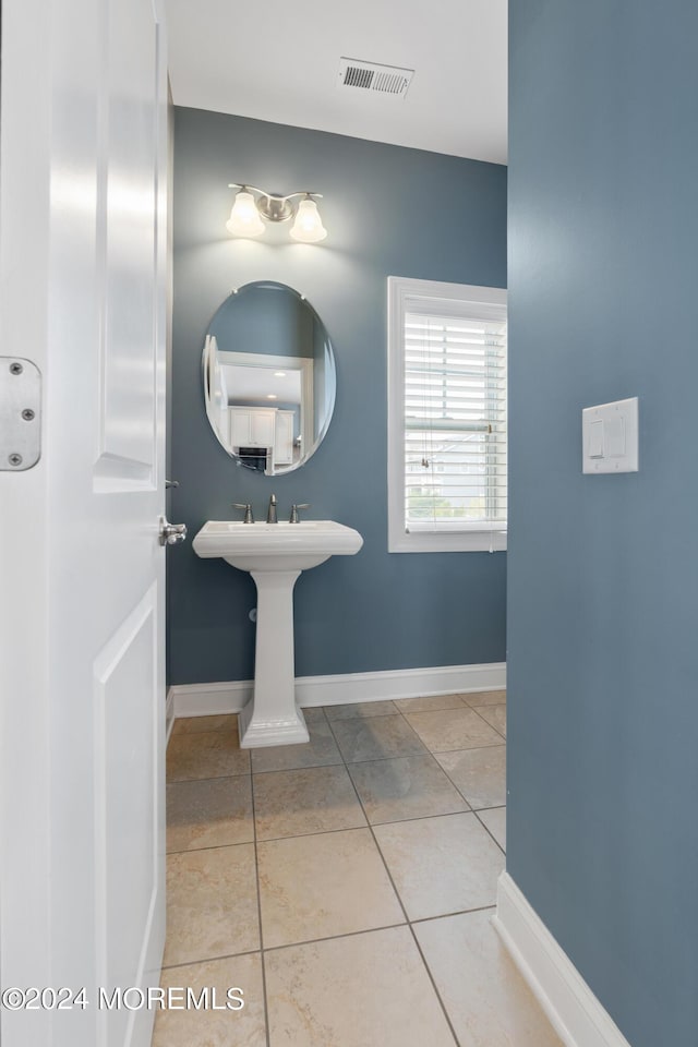 52 Seaview Ave, Long Branch, NJ 07740 - bathroom with tile patterned floors, baseboards, and a sink