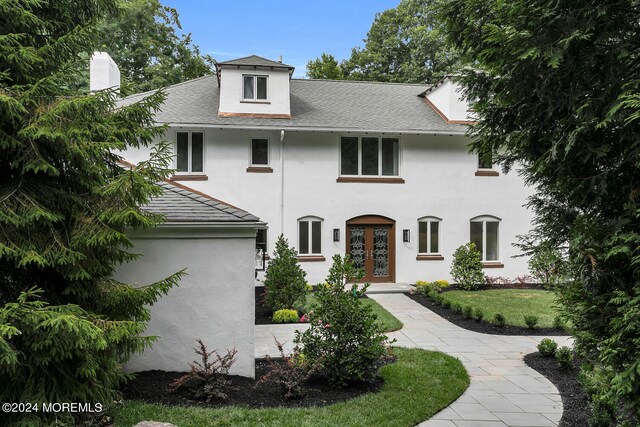 view of front of house featuring french doors and a front yard