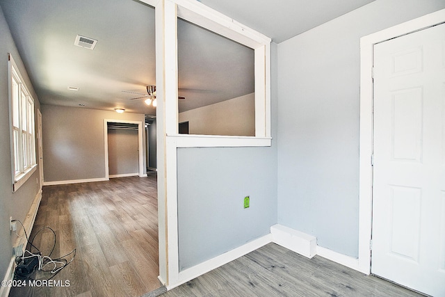 empty room with ceiling fan and hardwood / wood-style floors