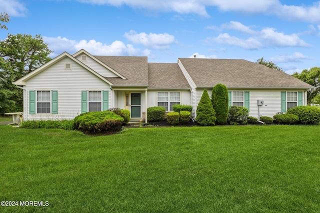 ranch-style house with a front lawn