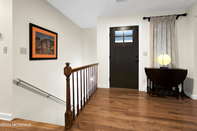 foyer entrance with dark hardwood / wood-style floors