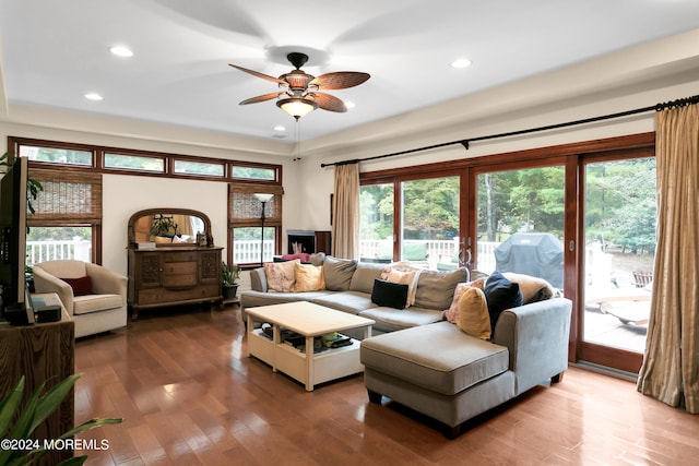 living room featuring french doors, wood-type flooring, and ceiling fan