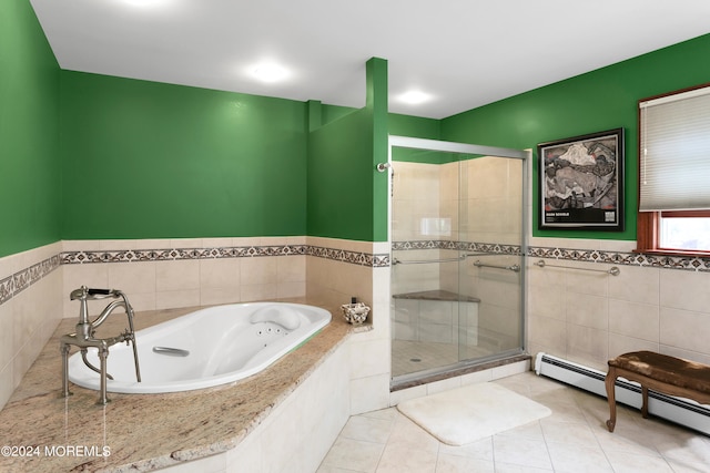 bathroom featuring shower with separate bathtub, a baseboard heating unit, and tile patterned flooring