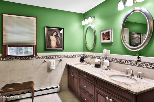 bathroom with tile walls, vanity, tile patterned floors, and baseboard heating