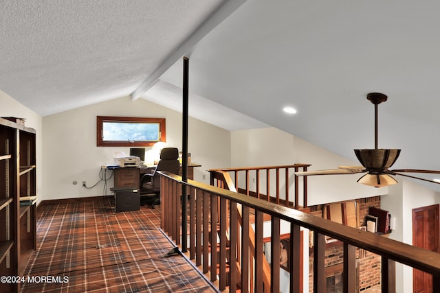 corridor with vaulted ceiling with beams