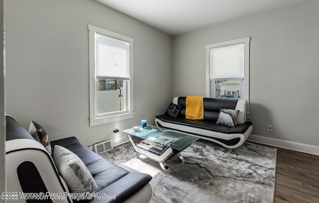 living area with hardwood / wood-style floors