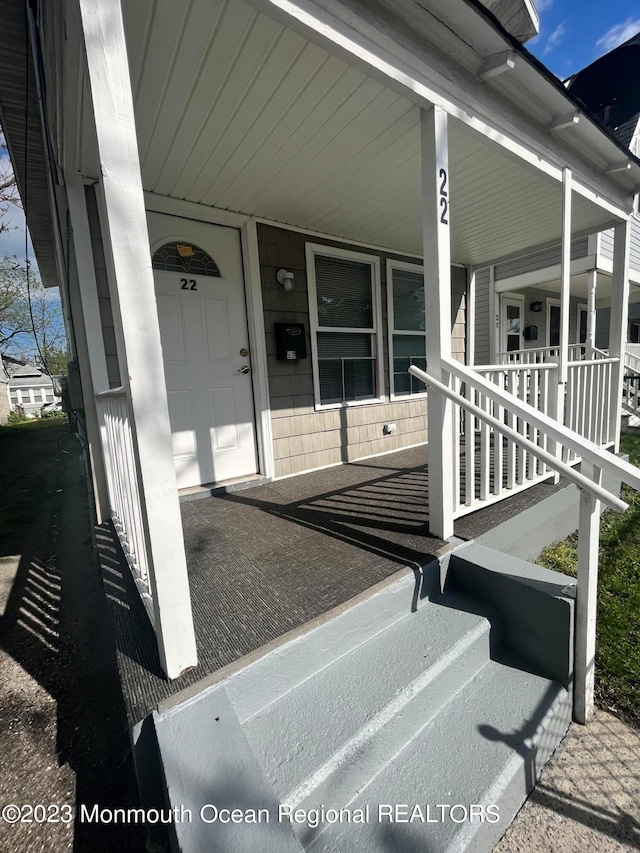 doorway to property with covered porch