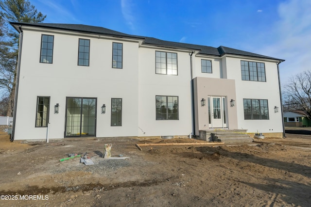 back of house with stucco siding