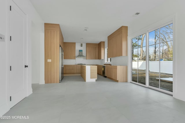 kitchen featuring dishwasher, wall chimney exhaust hood, modern cabinets, and high end refrigerator