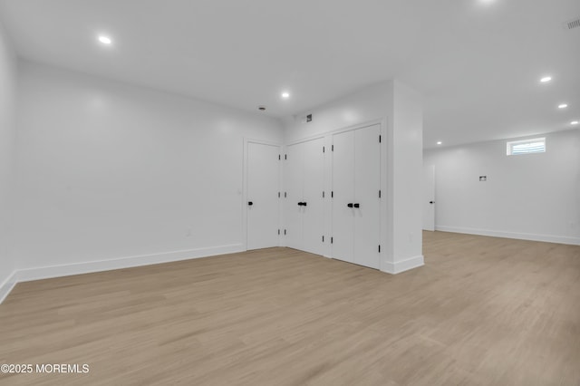 interior space with recessed lighting, baseboards, and light wood-type flooring