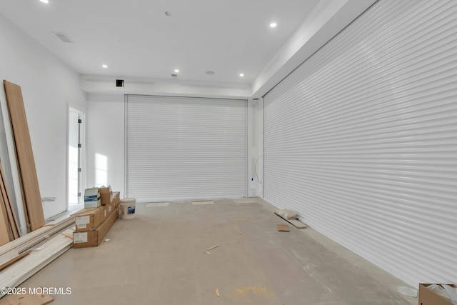 unfurnished room featuring recessed lighting, visible vents, and concrete floors