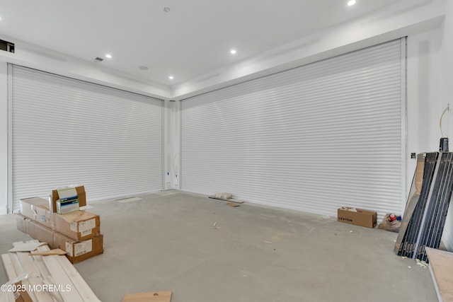 basement with recessed lighting and visible vents