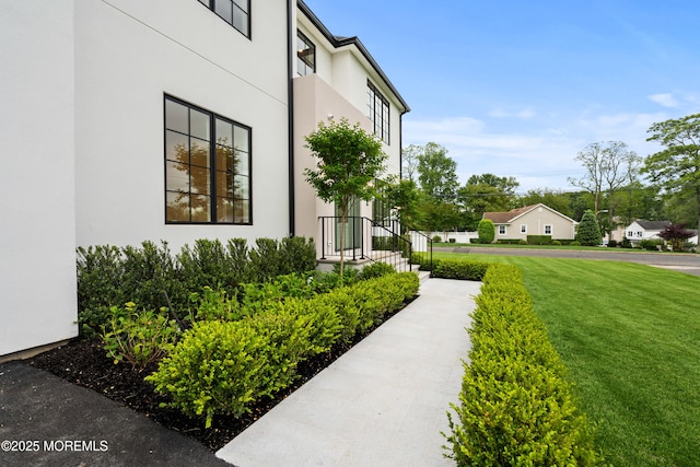 2 Deborah Pl, Oakhurst, NJ 07755 - view of property exterior with a yard and stucco siding